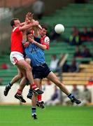 6 June 1999; Ciarán Whelan and Brian Stynes, hidden, of Dublin in action Séamus O'Hanlon, left, and Ken Reilly of Louth during the Bank of Ireland Leinster Senior Football Championship Quarter-Final match between Dublin and Louth at Croke Park in Dublin. Photo by Brendan Moran/Sportsfile