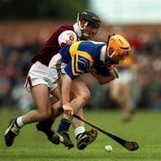16 May 1999; Eamonn Corcoran of Tipperary in action against Cathal Moore of Galway during the Church & General National Hurling League Division 1 Final match between Galway and Tipperary at Cusack Park in Ennis, Clare. Photo by David Maher/Sportsfile