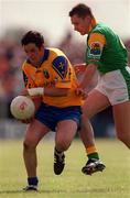 30 May 1999; Francie Grehan of Roscommon in action against James Phelan of Leitrim during the Bank of Ireland Connacht Senior Football Championship at Páirc Sheáin Mhic Dhiarmada in Carrick on Shannon, Leitrim. Photo by Brendan Moran/Sportsfile