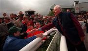 22 May 1999; Former RTÉ radio and TV programme presenter Gay Byrne greets fans at The Curragh Racecourse in Kildare. Photo by Ray McManus/Sportsfile