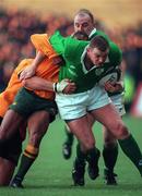 23 November 1999; David Corkery of Ireland is tackled by George Gregan of Austraila during the 1999 Rugby World Cup Pool E match between Ireland and Australia at Lansdowne Road in Dublin. Photo by Brendan Moran/Sportsfile