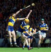 6 June 1999; Jamesie O'Connor of Clare in action against Eamonn Corcoran of Tipperary during the Guinness Munster Senior Hurling Championship Semi-Final match between Clare and Tipperary at Páirc Uí Chaoimh in Cork. Photo by Ray McManus/Sportsfile