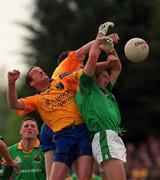 30 May 1999; Tom Ryan of Roscommon, supported by team-mate Stephen Lohan, in action against Jason Ward of Leitrim during the Bank of Ireland Connacht Senior Football Championship at Páirc Sheáin Mhic Dhiarmada in Carrick on Shannon, Leitrim. Photo by Brendan Moran/Sportsfile