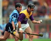 23 June 1996; Martin Storey of Wexford in action against Andy O'Callaghan of Dublin during the Guinness Leinster Senior Hurling Championship Semi-Final match between Dublin and Wexford at Croke Park in Dublin. Photo by Brendan Moran/Sportsfile