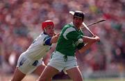 25 May 1997; Mike Galligan of Limerick is tackled by Stephen Frampton of Waterford during the Guinness Munster Senior Hurling Championship Quarter-Final match between Limerick and Waterford at Semple Stadium in Thurles, Tipperary. Photo by Brendan Moran/Sportsfile