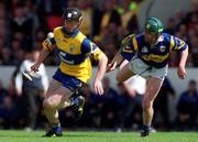 6 June 1999. Niall Gilligan of Clare in action against Donnacha Fahy of Tipperary during the Guinness Munster Senior Hurling Championship Semi-Final match between Clare and Tipperary at Páirc Uí Chaoimh in Cork. Photo by Ray McManus/Sportsfile