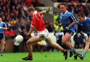 9 May 1999; Padraig O'Mahony of Cork in action against Paul Curran anad Keith Galvin, right, of Dublin during the Church & General National Football League Division 1 Final match between Cork and Dublin at Páirc Uí Chaoimh in Cork. Photo by Aoife Rice/Sportsfile