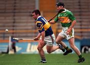 22 May 1999; Paul Shelley of Tipperary  in action against Maurice McCarthy of Kerry during the Guinness Munster Senior Hurling Championship Quarter-Final match between Tipperary and Kerry at Semple Stadium in Thurles, Tipperary. Photo by Brendan Moran/Sportsfile