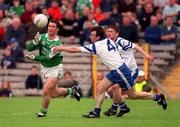 30 May 1999; Raymond Gallagher of Fermanagh in action against Noel Marron of Monaghan during the Bank of Ireland Ulster Senior Football Championship Preliminary Round match between Monaghan and Fermanagh at St Tiernach's Park in Clones, Monaghan. Photo by Damien Eagers/Sportsfile
