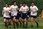 1 June 1999. From left; Robbie Keane, Keith O'Neill, Denis Irwin and Tony Cascarino lead the squad on a lap of the pitch during a Republic of Ireland training session at the AUL Complex in Clonshaugh, Dublin. Photo by Brendan Moran/Sportsfile