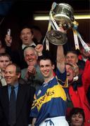 16 May 1999; Tipperary captain Thomas Dunne lifts the trophy after during the Church & General National Hurling League Division 1 Final match between Galway and Tipperary at Cusack Park in Ennis, Clare. Photo by Brendan Moran/Sportsfile