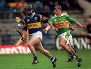 22 May 1999; Thomas Dunne of Tipperary gets past Willie Joe Leen of Kerry during the Guinness Munster Senior Hurling Championship Quarter-Final match between Tipperary and Kerry at Semple Stadium in Thurles, Tipperary. Photo by Brendan Moran/Sportsfile