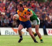 30 May 1999; Tom Ryan of Roscommon in action against Colin Regan of Leitrim during the Bank of Ireland Connacht Senior Football Championship at Páirc Sheáin Mhic Dhiarmada in Carrick on Shannon, Leitrim. Photo by Brendan Moran/Sportsfile