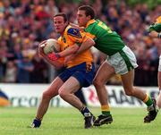 30 May 1999; Tom Ryan of Roscommon in action against Colin Regan of Leitrim during the Bank of Ireland Connacht Senior Football Championship at Páirc Sheáin Mhic Dhiarmada in Carrick on Shannon, Leitrim. Photo by Brendan Moran/Sportsfile