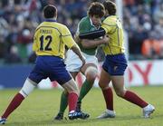 26 November 2005; Donncha O'Callaghan, Ireland, is tackled by Ionut Dimofte and Valentin Maftei (12), Romania. permanent tsb International Friendly 2005-2006, Ireland v Romania, Lansdowne Road, Dublin. Picture credit: Brian Lawless / SPORTSFILE