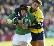 26 November 2005; Johnny O'Connor, Ireland, is tackled by Ionut Dimofte, Romania. permanent tsb International Friendly 2005-2006, Ireland v Romania, Lansdowne Road, Dublin. Picture credit: Brian Lawless / SPORTSFILE