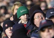 26 November 2005; A young Ireland fan keeps an eye on the action. permanent tsb International Friendly 2005-2006, Ireland v Romania, Lansdowne Road, Dublin. Picture credit: Brian Lawless / SPORTSFILE