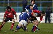 25 November 2005; Scott Deasy, Munster, is tackled by Rajan Reilly (7) and Eoin O'Malley, Leinster. Schools Interprovincial, Leinster Schools U18 v Munster Schools U18, Donnybrook, Dublin. Picture credit: Brian Lawless / SPORTSFILE