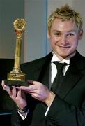 30 November 2005; European Indoor 400m Champion David Gillick with his award at the 48th Texaco Sportstars Awards. Burlington Hotel, Dublin. Picture credit: Brendan Moran / SPORTSFILE