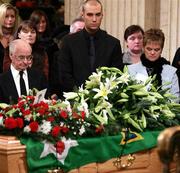 3 December 2005; Dickie Best, Calum Best, centre, and Barbara Best stand beside the coffin of George Best in Parliment Buildings, Stormont, Belfast, Co. Antrim. Picture credit: PA Pool / SPORTSFILE