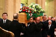 3 December 2005; George Best's coffin is carried into the Parliament Buildings in Stormont, Belfast, Co. Antrim. Picture credit: PA Pool / SPORTSFILE