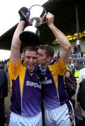 4 December 2005; Kilmacud Crokes players and brothers Johnny, left and Darren Magee celebrate with the Sean McCabe Cup. Leinster Club Senior Football Championship Final, Sarsfields v Kilmacud Crokes, Navan, Co. Meath. Picture credit: Damien Eagers / SPORTSFILE
