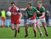 6 April 2014; James Kearney, Derry, in action against Shane McHale and Kevin Keane, Mayo. Allianz Football League, Division 1, Round 7, Mayo v Derry, Elverys MacHale Park, Castlebar, Co. Mayo. Picture credit: Ray Ryan / SPORTSFILE