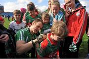 6 April 2014; Mayo goalkeeper Robert Hennelly signs autographs after the game. Allianz Football League, Division 1, Round 7, Mayo v Derry, Elverys MacHale Park, Castlebar, Co. Mayo. Picture credit: Ray Ryan / SPORTSFILE
