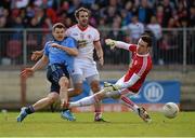6 April 2014; Kevin McManamon, Dublin, shoots past Tyrone's Mark Donnelly and goalkeeper Niall Morgan only to have his shot cleared off the goal line late in the game. Allianz Football League, Division 1, Round 7, Tyrone v Dublin, Healy Park, Omagh, Co. Tyrone. Picture credit: Ray McManus / SPORTSFILE