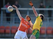 6 April 2014; Charles Vernon, Armagh, in action against Michael Murphy, Donegal. Allianz Football League, Division 2, Round 7, Armagh v Donegal, Athletic Grounds, Armagh. Picture credit: Brendan Moran / SPORTSFILE