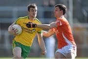 6 April 2014; Leo McLoone, Donegal, in action against Stephen Harold, Armagh. Allianz Football League, Division 2, Round 7, Armagh v Donegal, Athletic Grounds, Armagh. Picture credit: Brendan Moran / SPORTSFILE