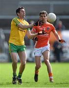 6 April 2014; Rory Kavanagh, Donegal, in action against Stephen Harold, Armagh. Allianz Football League, Division 2, Round 7, Armagh v Donegal, Athletic Grounds, Armagh. Picture credit: Brendan Moran / SPORTSFILE