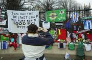 2 December 2005; A George Best supporter takes a photograph outside stormont gates before the funeral of George Best. Belfast, Co. Antrim. Picture credit: Damien Eagers / SPORTSFILE