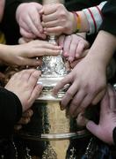 9 December 2005; Pupils from Yellowfurze National School, Yellowfurze touch the FAI Carlsberg Cup, during a visit by Drogheda United's Gavin Whelan. Yellowfurze, Co. Meath. Picture credit: David Maher / SPORTSFILE