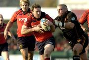 10 December 2005; John Kelly, Munster, is tackled by Rhys Thomas, Newport Gwent Dragons. Heineken Cup 2005-2006, Pool 1, Munster v Newport Gwent Dragons, Rodney Parade, Newport, Wales. Picture credit: Matt Browne / SPORTSFILE