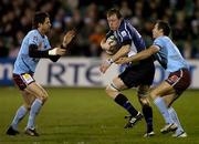 10 December 2005; Eric Miller, Leinster, is tackled by Glenn Davis, left, and Mickael Forest, Bourgoin. Heineken Cup 2005-2006, Pool 5, Leinster v Bourgoin, RDS, Dublin. Picture credit: Brendan Moran / SPORTSFILE
