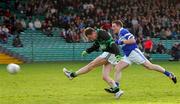 11 December 2005; James Masters, Nemo Rangers, shots to score a goal despite the attention of Thomas Galvin, St. Senan's. Munster Club Senior Football Championship Final, St. Senans v Nemo Rangers, Gaelic Grounds, Limerick. Picture credit: Kieran Clancy / SPORTSFILE