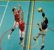 13 December 2005; Joseph McHugh, St Louis College, Kiltimagh, Mayo in action against Dermot McKeon, 7 and Ciaran Kelly, 15, Drumshambo Vocational School, Leitrim. All-Ireland Colleges Volleyball, Boys Senior A Final, St Louis College, Kiltimagh, Mayo v Drumshambo Vocational School, Leitrim, UCD, Dublin. Picture credit: Damien Eagers / SPORTSFILE