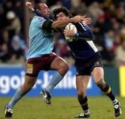 17 December 2005; Shane Horgan, Leinster, is tackled by Pascal Peyron, Bourgoin. Heineken Cup 2005-2006, Pool 5, Round 4, Bourgoin v Leinster, Stade Pierre Rajon, Bourgoin-Jallieu, France. Picture credit: Brian Lawless / SPORTSFILE