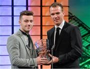 2 March 2014; Jack Byrne, from Dublin and playing for Manchester City, is presented with the U.17 International player of the year award by Republic of Ireland International Glenn Whelan. Three FAI International Football Awards, RTE Studios, Donnybrook, Dublin. Picture credit: David Maher / SPORTSFILE