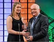 2 March 2014; Ciara Grant, from Waterford and playing for Arsenal FC, is presented with the Special Merit award by FAI president Paddy McCaul. Three FAI International Football Awards, RTE Studios, Donnybrook, Dublin. Picture credit: David Maher / SPORTSFILEE
