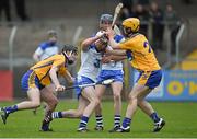 9 April 2014; Jack Mullaney, Waterford, in action against Ian Galvin, left, and Jason McCarthy, Clare. Electric Ireland Munster GAA Hurling Minor Championship, Quarter-Final, Clare v Waterford, Cusack Park, Ennis, Co. Clare. Picture credit: Diarmuid Greene / SPORTSFILE