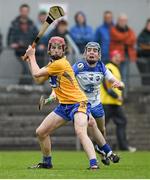 9 April 2014; Michael O'Malley, Clare, in action against Patrick Curran, Waterford. Electric Ireland Munster GAA Hurling Minor Championship, Quarter-Final, Clare v Waterford, Cusack Park, Ennis, Co. Clare. Picture credit: Diarmuid Greene / SPORTSFILE