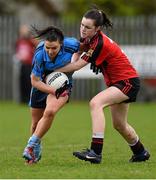 10 April 2014; Niamh O'Keefe, Eureka, Kells, in action against Róisín O'Toole, Ballinamore Secondary School, Ballinamore. Tesco HomeGrown Post Primary School Junior B, Ballinamore Secondary School, Ballinamore, Co. Leitrim v Eureka, Kells, Co. Meath, St.Phelam's Park, Drumalee, Co.Cavan. Picture credit: Barry Cregg / SPORTSFILE
