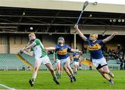 10 April 2014; Limerick goalkeeper Eoghan McNamara in action against Ross Peters and Willie Coffey, right, Tipperary. Electric Ireland Munster GAA Hurling Minor Championship, Quarter-Final, Limerick v Tipperary. Gaelic Grounds, Limerick. Picture credit: Diarmuid Greene / SPORTSFILE
