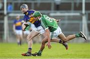 10 April 2014; Robbie Hanley, Limerick, in action against Alan Tynan, Tipperary. Electric Ireland Munster GAA Hurling Minor Championship, Quarter-Final, Limerick v Tipperary. Gaelic Grounds, Limerick. Picture credit: Diarmuid Greene / SPORTSFILE