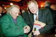 13 December 2005; Con Houlihan with publican Charlie Chawke at the launch of his latest book 'A Harvest', published by Boglark Press at 14.95 euro,  in Mulligan's of Poolbeg Street, Dublin. Picture credit: Ray McManus / SPORTSFILE