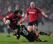 17 December 2005; Marcus Horan, Munster, is tackled by Aled Thomas, Newport Gwent Dragons. Heineken Cup 2005-2006, Pool 1, Round 4, Munster v Newport Gwent Dragons, Thomond Park, Limerick. Picture credit: Kieran Clancy / SPORTSFILE