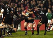 17 December 2005; Marcus Horan, Munster, is tackled by Adam Black, left and Gethin Robinson, (3), Newport Gwent Dragons. Heineken Cup 2005-2006, Pool 1, Round 4, Munster v Newport Gwent Dragons, Thomond Park, Limerick. Picture credit: Damien Eagers / SPORTSFILE
