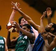 18 December 2005; Will McClurkin, Shamrock Rovers Hoops, in action against Michael Doles, right, and Niall O'Reilly, UCC Demons. Men's Superleague, Round 9, Shamrock Rovers Hoops v UCC Demons, National Basketball Arena, Tallaght, Dublin. Picture credit: David Maher / SPORTSFILE